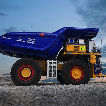 An ultra-class haul truck that's three-stories tall retrofitted with a diesel-free engine by First Mode.