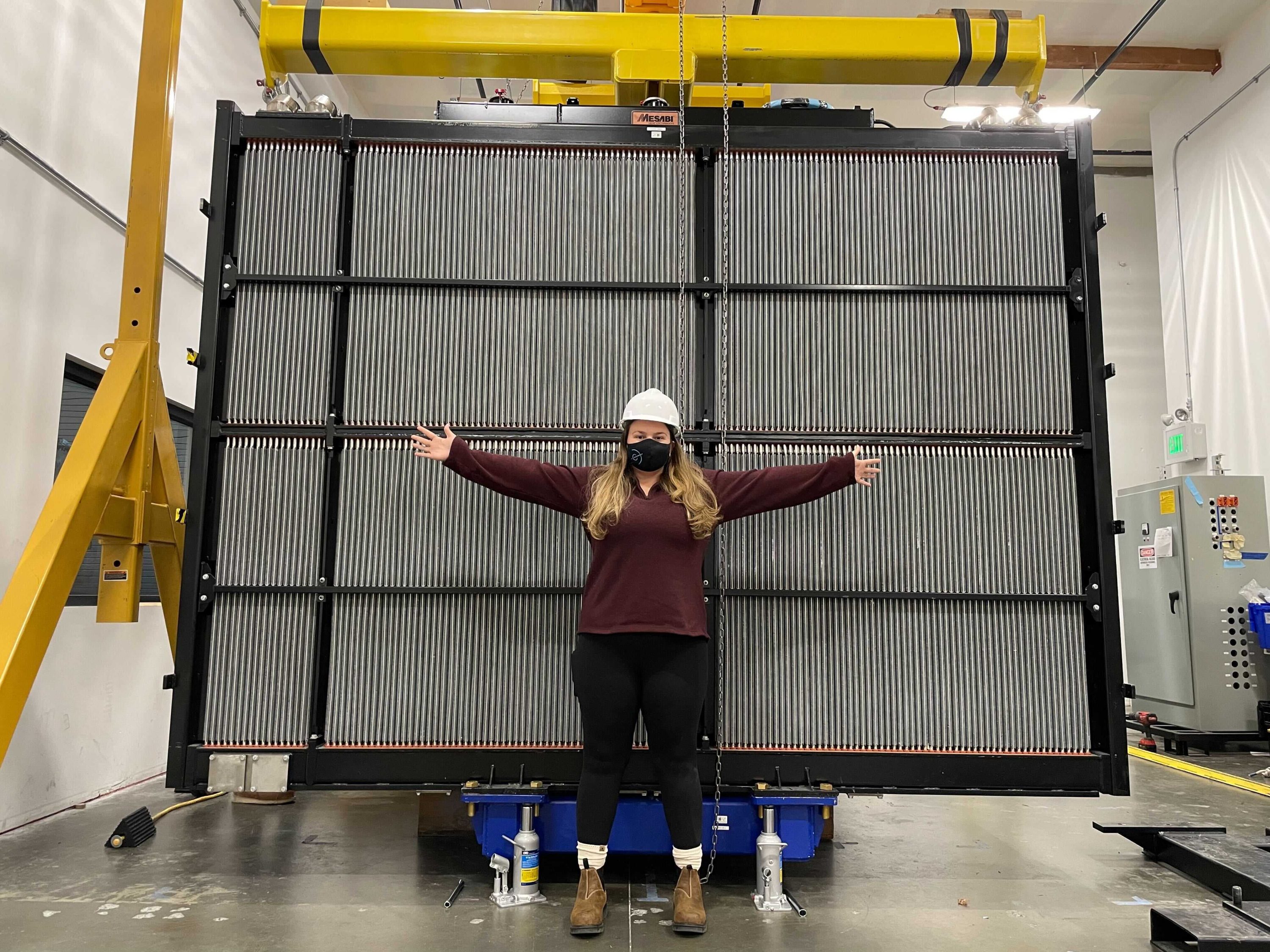 Amber Baurley standing in front of First Mode powerplant